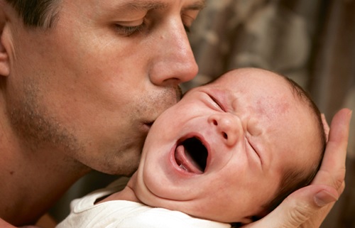 Symptoms can also include a red, flushed face and they may clench their fists, draw their knees up to the chest or arch their back.